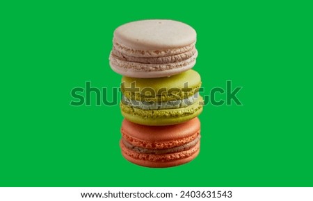 Colorful delicious french macarons on green screen