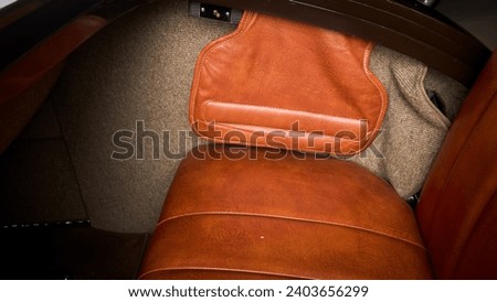 Rumble seat in the back of a car showing the side Royalty-Free Stock Photo #2403656299