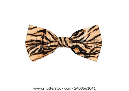 Fashionable beige bow tie with tiger pattern isolated on white background