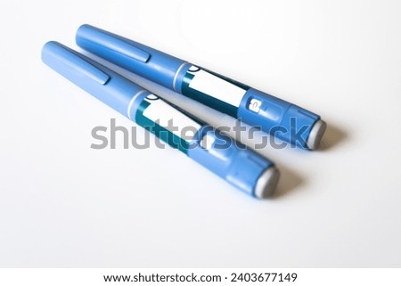 Ozempic Insulin injection pen or insulin cartridge pen for diabetics. Medical equipment for diabetes parients. Royalty-Free Stock Photo #2403677149