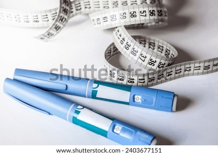 Ozempic Insulin injection pen or insulin cartridge pen for diabetics. Medical equipment for diabetes parients. Royalty-Free Stock Photo #2403677151
