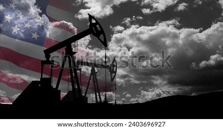 The change in oil prices caused by the war. Oil price cap concept. Oil drilling derricks at desert oilfield with USA flag. Crude oil production from the ground. Petroleum production. Royalty-Free Stock Photo #2403696927