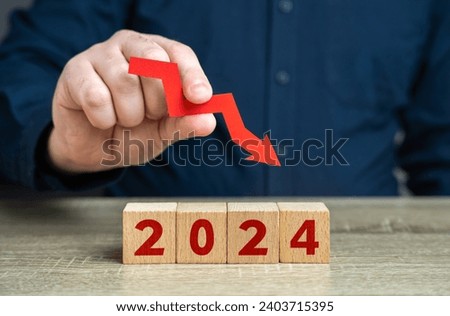 2024 and red arrow down. Forecast for an decrease next year. Fall in profits and orders, economic decline. Unfavorable investment conditions. Stagnation and recession. A crisis. Pessimistic forecast. Royalty-Free Stock Photo #2403715395