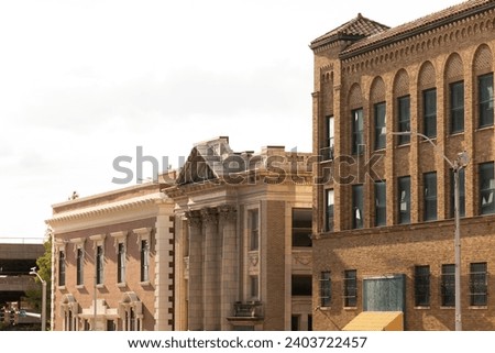 Topeka, Kansas, USA - June 17, 2023: Afternoon light shines on historic buildings in downtown Topeka.