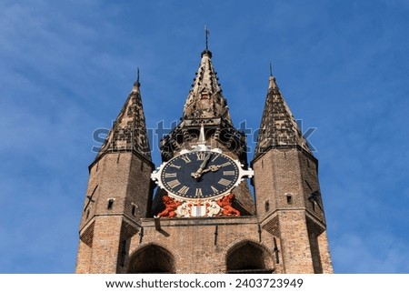 Old Church (Oude Kerk, was founded in 1246) is a Gothic Protestant church in Delft, Netherlands. Its most recognizable feature is a 75-meter-high brick tower that leans about two meters from vertical. Royalty-Free Stock Photo #2403723949