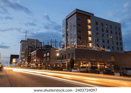 Topeka, Kansas, USA - June 17, 2023: Evening traffic streams down Kansas Ave in the heart of historic downtown Topeka.