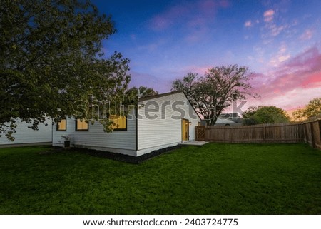 a back yard at sunset  Royalty-Free Stock Photo #2403724775