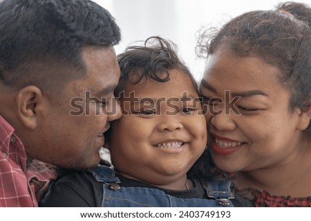 Asian family happy and little girl in sofa with family. The emotion of a child when tantrum and mad.Kid expression lovely emotion. Kid emotional control concept.