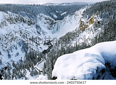 Yellowstone Falls River Grand Canyon in Winter in Yellowstone National Park, Wyoming Montana. Northwest. Yellowstone is a winter wonderland, to watch the wildlife and natural landscape. Geothermal