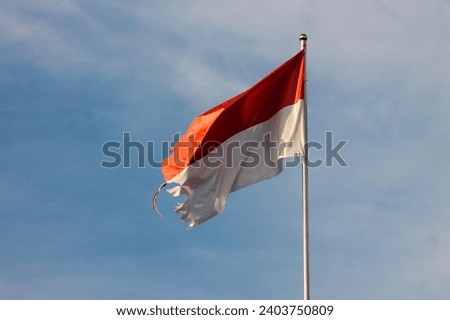 Old Indonesian flag on the wind
