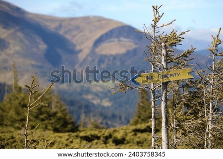 Arrow sign to Mount Hoverla direction hanging peak of the Ukrainian Carpathians