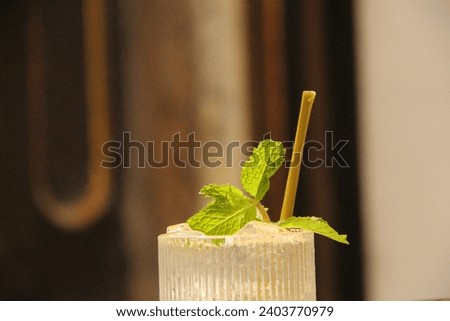 Cold drinks with mint leaf garnish are available at Toko Merah Kota Tua Jakarta café