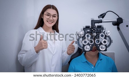 Doctor ophthalmologist checking eye vision of young woman doing eyesight measurement with optical phoropter check eye distance for eyeglasses.