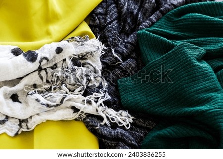Close-up shot of winter sweaters placed together. Abstract background.
