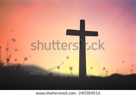 Symbol for resurrection, holy bible, easter and Jesus Christ. Silhouette cross over blurred sunset background.