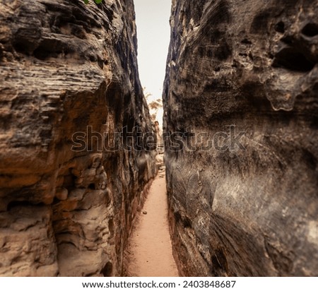 Close up of small narrow passage between stones in canyonlands national park in Utah, America, usa Royalty-Free Stock Photo #2403848687