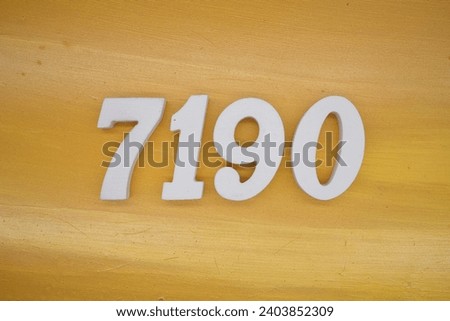 The golden yellow painted wood panel for the background, number 7190, is made from white painted wood.
