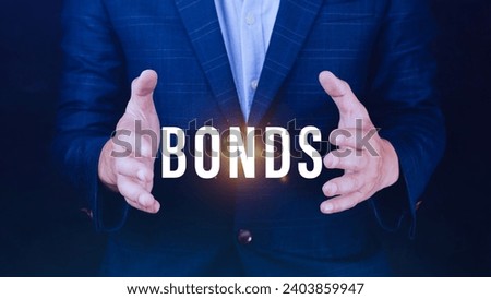 Businessman holding bonds virtual screen. Bond Finance Banking Technology concept, Trade Market Network, bond security that indicates the investor has provided loan the issuer, Equivalent loan Royalty-Free Stock Photo #2403859947