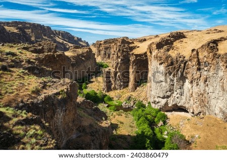 Jagged Rock Formations at Succor Creek State Natural Area, Oregon Royalty-Free Stock Photo #2403860479