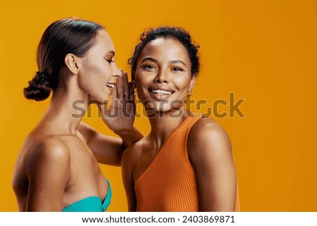 Skin woman race model african two face happy american beautiful beauty together colorful make-up mixed studio
