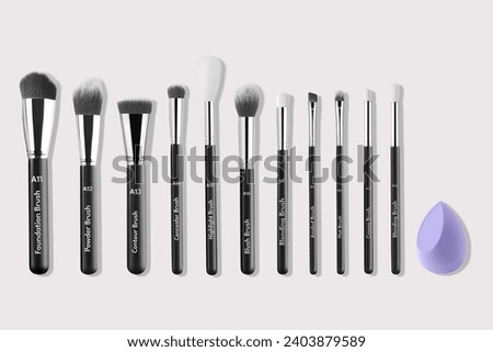 Professional makeup brush made of natural pile on a gray background Royalty-Free Stock Photo #2403879589