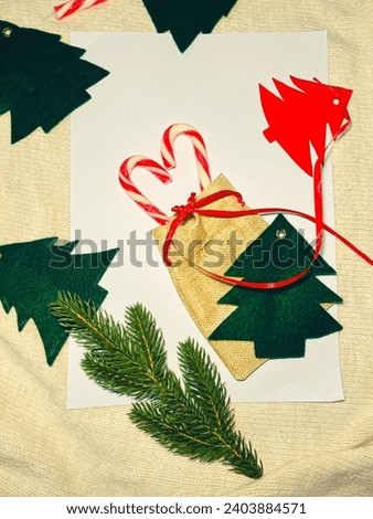White sheet with Christmas trees and candies
