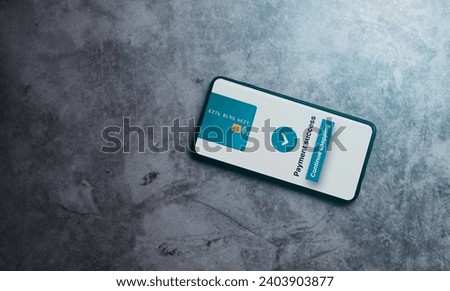 Top view photo of smartphone with online purchase confirmation. Business app. Shopping online. Digital transfer. Credit card.