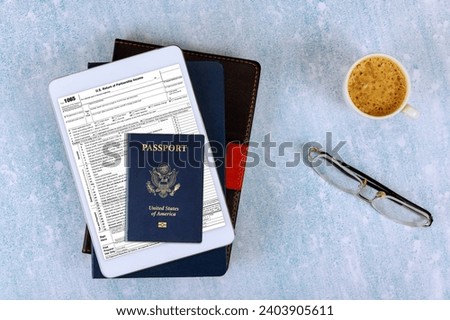 Return of Partnership Income Tax Form 1065 with online form filling, American passport, tax period Royalty-Free Stock Photo #2403905611