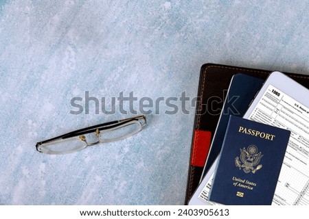 American passport, US Return of Partnership Income Tax Form 1065 with online form filling tax period Royalty-Free Stock Photo #2403905613
