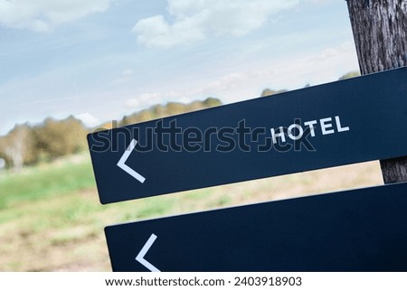 Hotel sign on a panel in a park