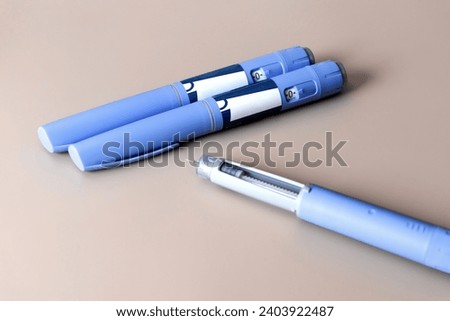 Ozempic Insulin injection pen or insulin cartridge pen for diabetics. Medical equipment for diabetes parients. Royalty-Free Stock Photo #2403922487