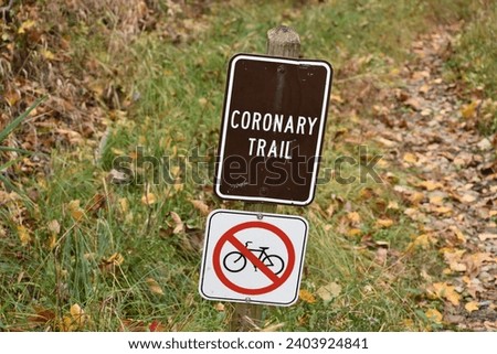 Coronary hiking trail no bicycles sign