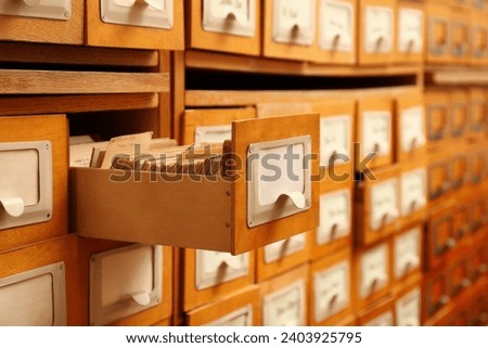 Closeup view of library card catalog drawers Royalty-Free Stock Photo #2403925795