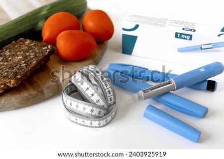 Ozempic Insulin injection pen or insulin cartridge pen for diabetics. Medical equipment for diabetes parients.  Royalty-Free Stock Photo #2403925919