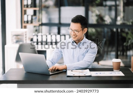 Mature business man executive manager looking at laptop watching online webinar training or having virtual meeting video conference doing market research working in office.