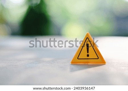 close up caution sign on wood table, planning and manage to success business concept Royalty-Free Stock Photo #2403936147