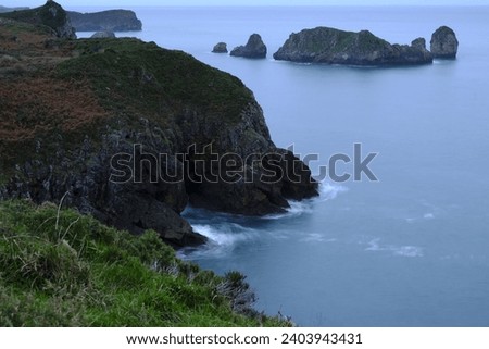 When night falls on the coast of the beaches of Llanes, the intense blue that fills the atmosphere on the typical green of the area of the beaches of Asturias