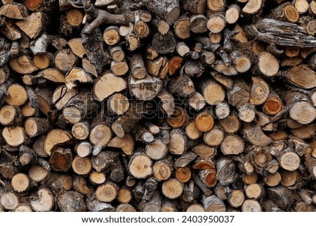 Background of stacked and chopped firewood. Wood logs. High quality photo