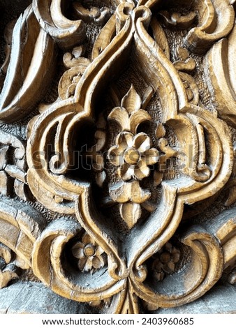 Detail of wooden column (IX century) in Djuma Mosque, Khiva, Uzbekistan Royalty-Free Stock Photo #2403960685