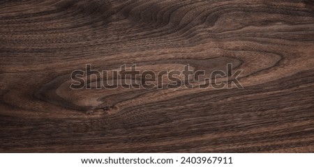 Walnut texture background. Dark wooden plank desktop texture background.