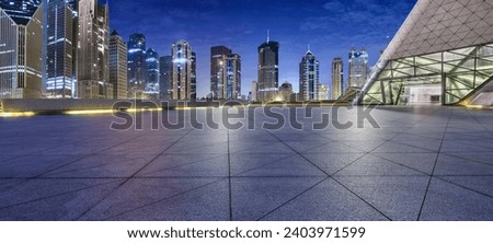 City square floor and modern commercial building scenery at night in Shanghai, China. Famous financial district buildings in Shanghai.