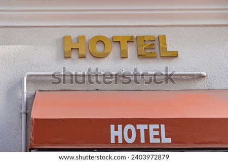 Gold 3d Sign Hotel at White Building Wall