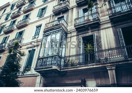 Facade of old apartment building with balcony, Barcelona, Catalonia. Spain photo. Beautiful urban scenery photography. Street scene. High quality picture for wallpaper, article
