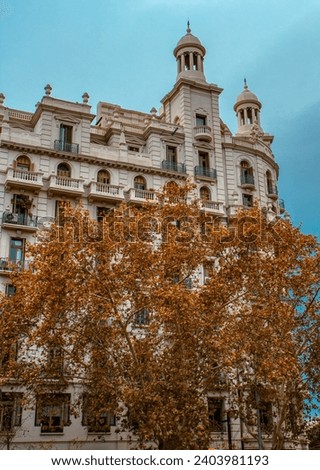 Historical apartment building in Europe city photo. Autumnal Barcelona, Catalonia. Beautiful urban scenery photography. Street scene. High quality picture for wallpaper, article