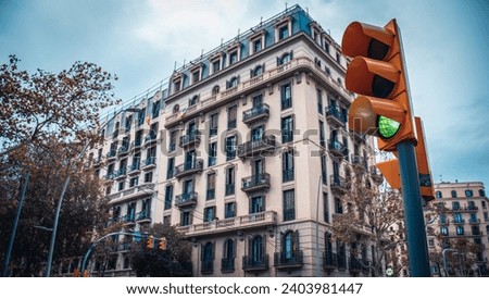 Old apartment building near road. Beautiful urban scenery photography. Road traffic light. Barcelona street scene. High quality picture for wallpaper, article