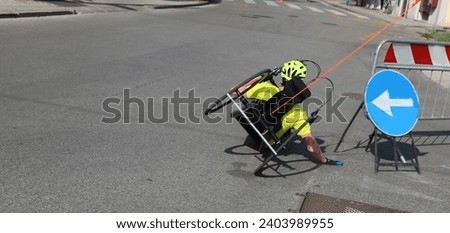 competition wheelchair for paralympic athletes race during a challenging curve while doing the competitive race in the city