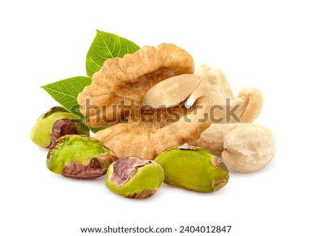 Cashew, walnut and pistachios   in closeup isolated on white background. Nuts assorty. Royalty-Free Stock Photo #2404012847