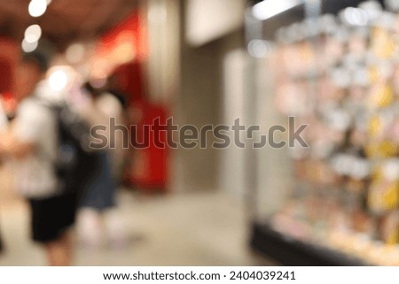 blur people Shopping in super store with bokeh light background.
