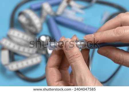 Ozempic Insulin injection pen or insulin cartridge pen for diabetics. Medical equipment for diabetes parients.  Royalty-Free Stock Photo #2404047585