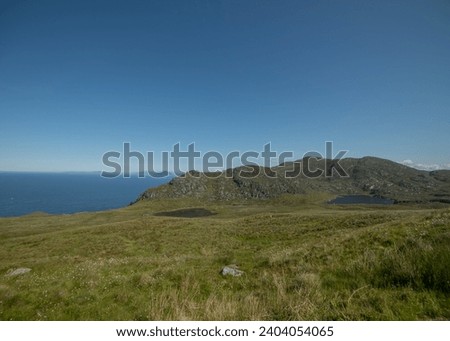 View of the Beautiful and Famous Bird Island Runde in the Western Part of Norway. View with cliffs and Atlatic ocean